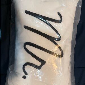 White Pillow with Black Script Design